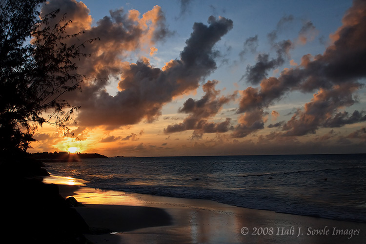 2008_12_14_SandalsAntigua-265.jpg - Sunset over Dickinson Bay, unfortunately they appear to be building condo's or houses out on the point. There is also an offshore (oil?) platform in the area, so the sunsets from the resort aren't as nice as those at the other Sandals we've visited.