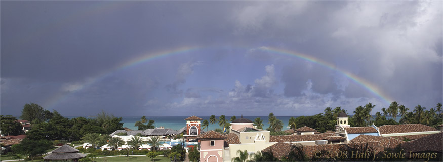 2008_12_16_SandalsAntigua_0039-Edit.jpg - (Double) Rainbow over Dickinson Bay, seen from  the alcove in the Almond Building. Look closely at the area above the primary rainbow to see the second one.