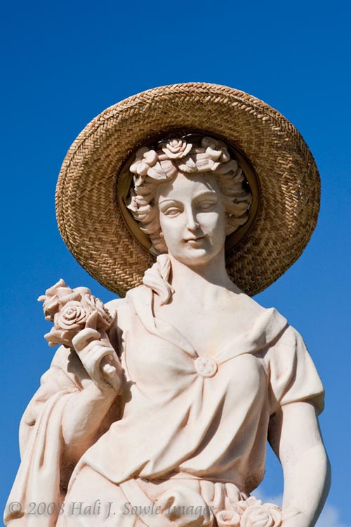 2008_12_20_SandalsAntigua-30-Edit.jpg - Another statue on the grounds. Every morning we would find this straw hat on the statue.  It would disappear most afternoons and show up again the next morning.