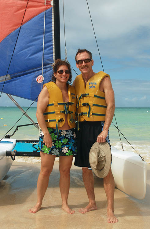 Sandals2.jpg - The first few days had some pretty good wind.  This shot (taken by a Sandals photographer) was snapped just after an exciting sail on the Hobie.  We didn't tip it over, but the Tilley hat was christened once again.