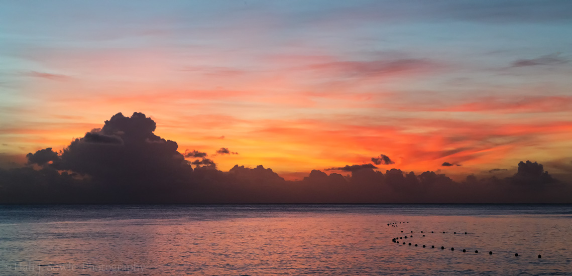 2016_11_Barbados-10039-Edit1000.jpg - Our room had an amazing sunset view.  This was the view outside our room our first night there.  The buoys surround the protected snorkeling area.