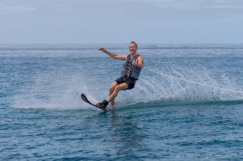 2016_11_Barbados-10070-Edit1000.jpg - One of the reasons we picked this resort was they offered water-skiing.  The water wasn't the most smooth but they took Mike out every morning they could.  As a bonus they let me ride along and shoot, if there wasn't another guest that wanted to ski there was a water sports guy that would sit in the front so I could sit out back to take pictures.