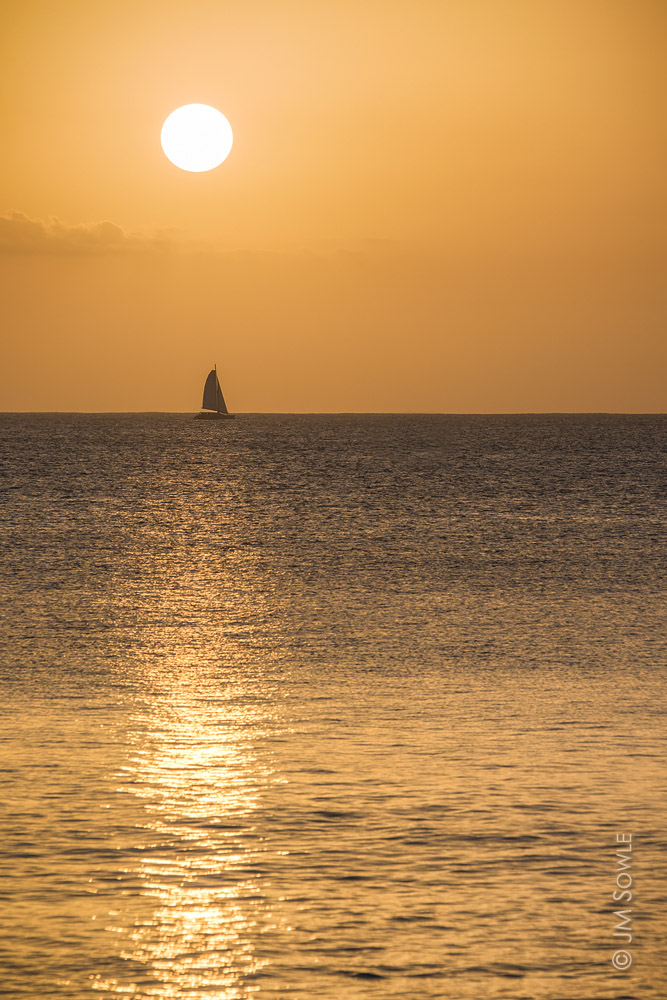 _JMS0206LS.jpg - A small catamaran out enjoying the sunset.