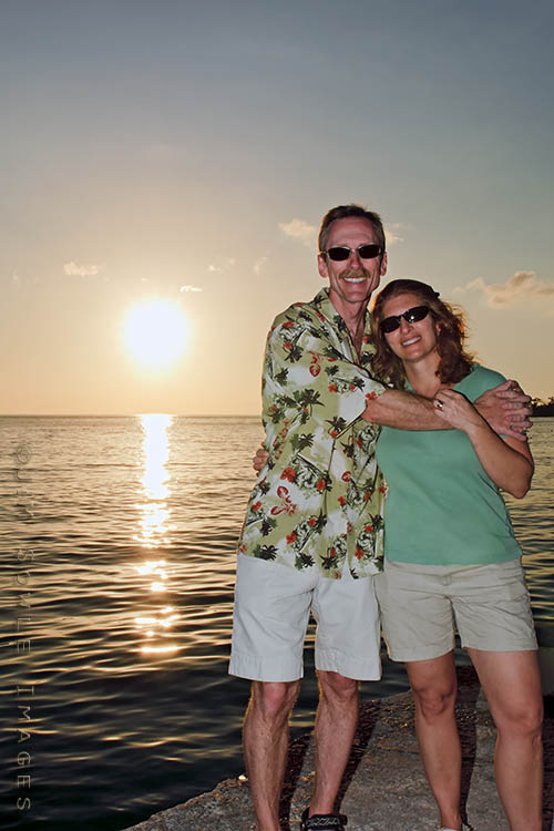 _MIK0172A.jpg - Our resort did not have good sunset views.  Fortunately, we only had a 5 minute walk to a resort with excellent sunset views.  Unfortunately, that resort is called "Hedonism".  We were the only people on this pier with clothes on!  It was a very interesting sunset.