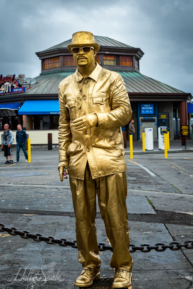 2015_05_California-10093-Edit1000.jpg - Performance art on the Embarcado.  This gentleman would give candy to the people who came by to shake his hand.  Further down the wharf there was a man that was silver but he wasn't posing.
