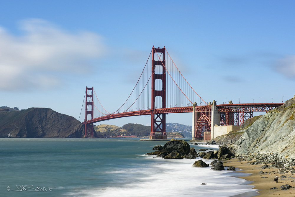 _JMS0510.jpg - The Golden Gate Bridge from Marshall's Beach.  If you look in the bottom right corner of the image, you can see Hali taking her shots.  She is a little blurry because this was a very long exposure.