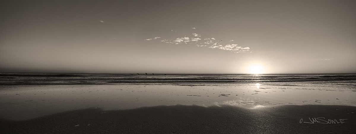 _JMS0272_HDR.jpg - Sunrise at Marineland Beach, with Pelicans gliding over the small waves.