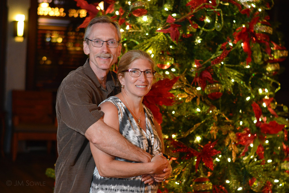 2613148Adj.jpg - Later in the trip they started putting out Christmas decorations.  An enterprising resort photographer was getting shots of people as the walked past the tree.  Why not?