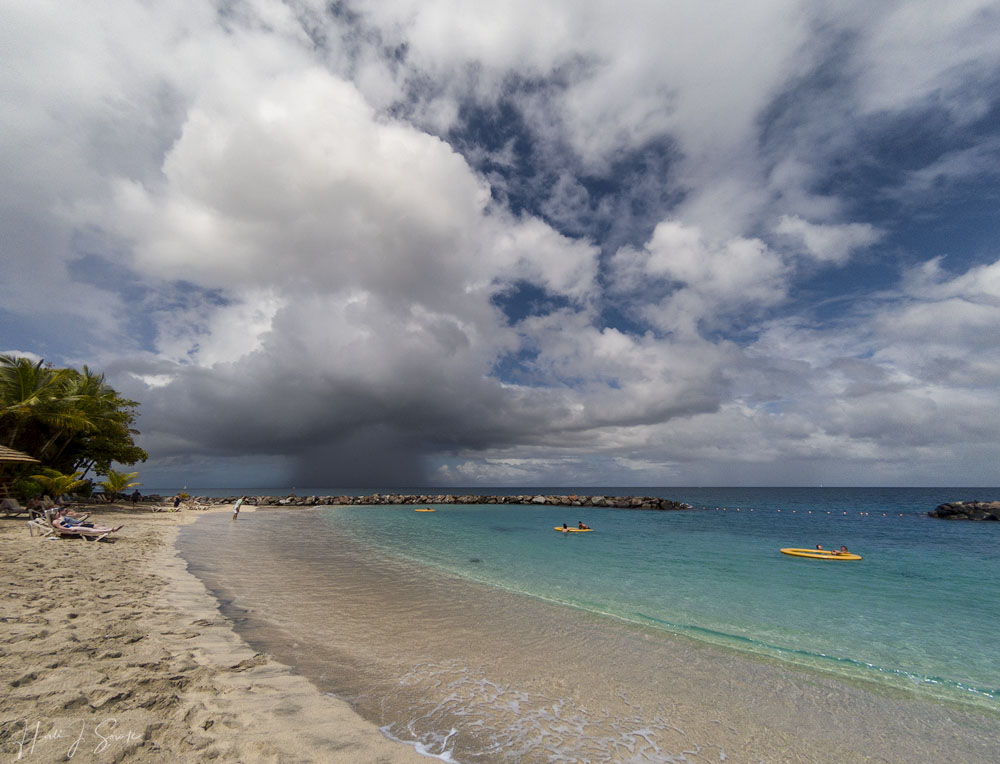 GOPR0292-Edit1000.jpg - The days were mostly warm and sunny but there was a good deal of wind and sometimes the clouds would roll in and bring a good downpour.  I caught this big storm sliding off to the west of the Island one morning.