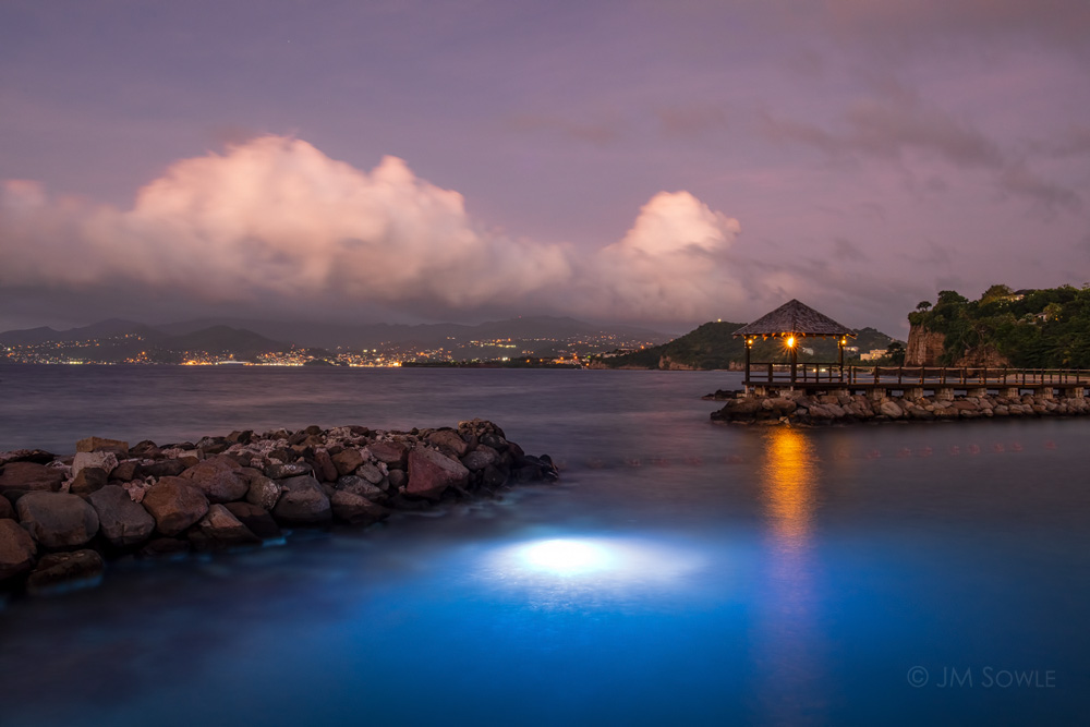 _MS00974.jpg - There were a couple of large underwater lights by one of the piers, and the fish swarmed around those lights at night.  The port town of St George can be seen in the distance.