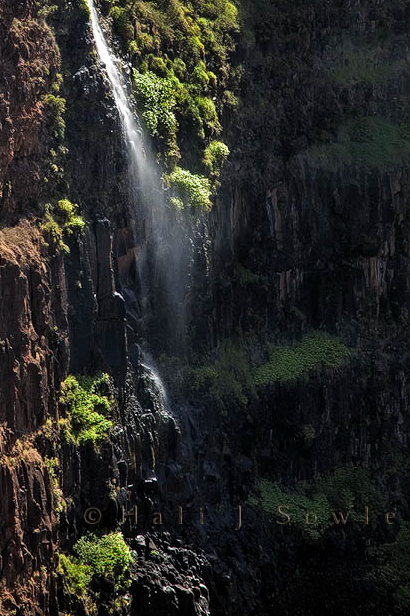 2009_09_28_Hawaii-176.jpg - You couldn't see this waterfall from the lookout but a short drive further up the road revealed it in the stray shafts of sunlight that were making their way through the clouds