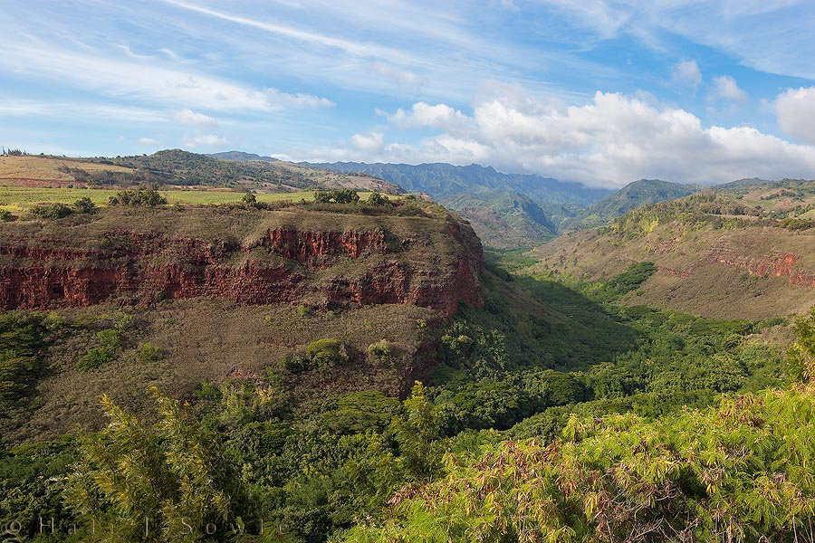 2009_09_30_Hawaii-10163.jpg - The view from the Hanapepe Valley lookout over the now peaceful Hanapepe Valley.  This valley was the scene of the most brutal and bloody battle to have taken place on Kaua'i when Kamehameha's forces came to put down the revolt led by the son of Kaua'i's last "independent" king.  Uninvolved women, men and children along with those involved in the revolt were wantonly slaughtered.