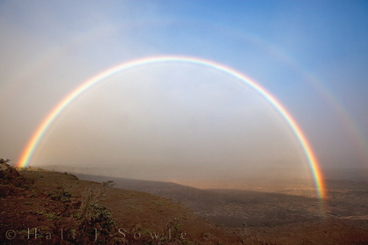 2009_10_02_Hawaii-10379.jpg - On our last afternoon at the Volcano House we became "rainbow chasers" chasing this rainbow from the Steam Vents all the way to the Jaggar Museum (which is as far as we could go anyhow).  It was spectacular to see such a bright double rainbow over such a barren landscape.