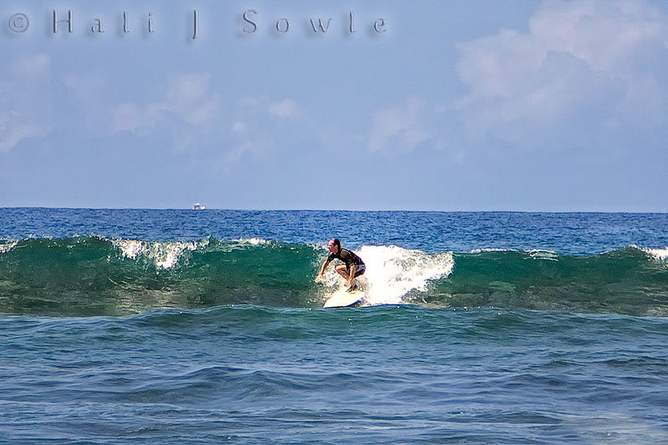 209_10_08_Hawaii-10489.jpg - Mike decided to do a little surfing on our last full day (at Kahalu'u beach).  There was only small surf and a lot of people learning but as always he made the best of it.