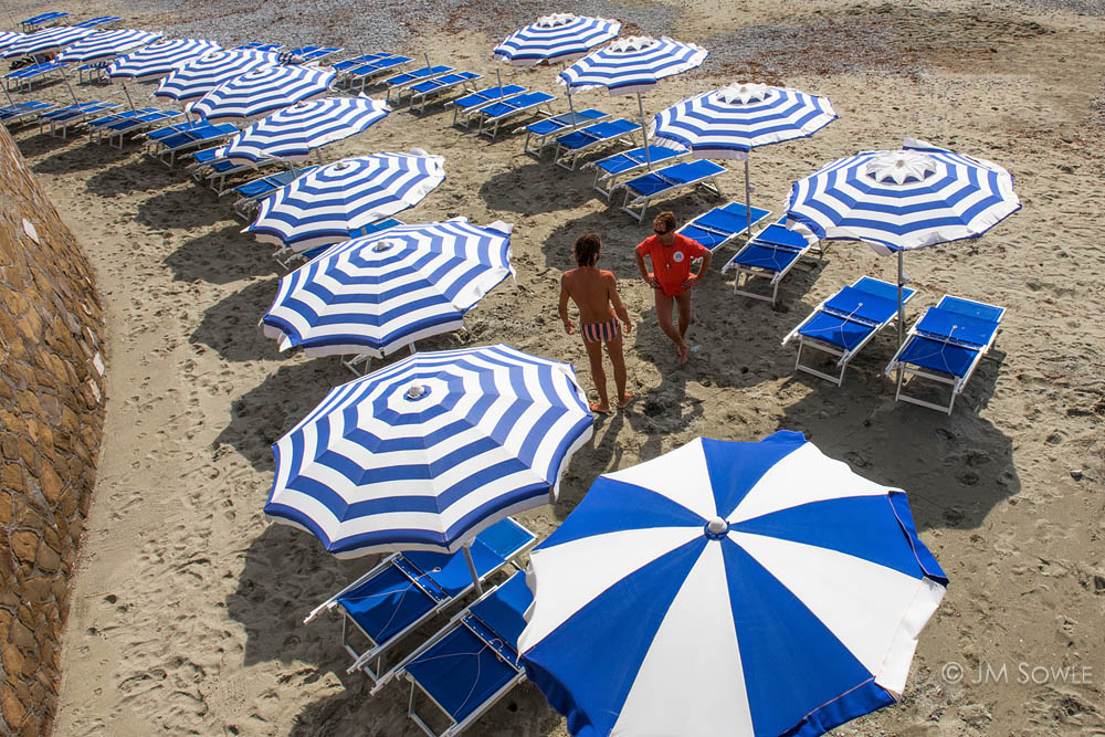 _JMS2177.jpg - The beach at Monterosso must be a madhouse in summer, but it wasn't too bad in September.  There were only a handful of people swimming and such.  It was certainly nice enough for many people to walk the street by the beach while enjoying gelato.