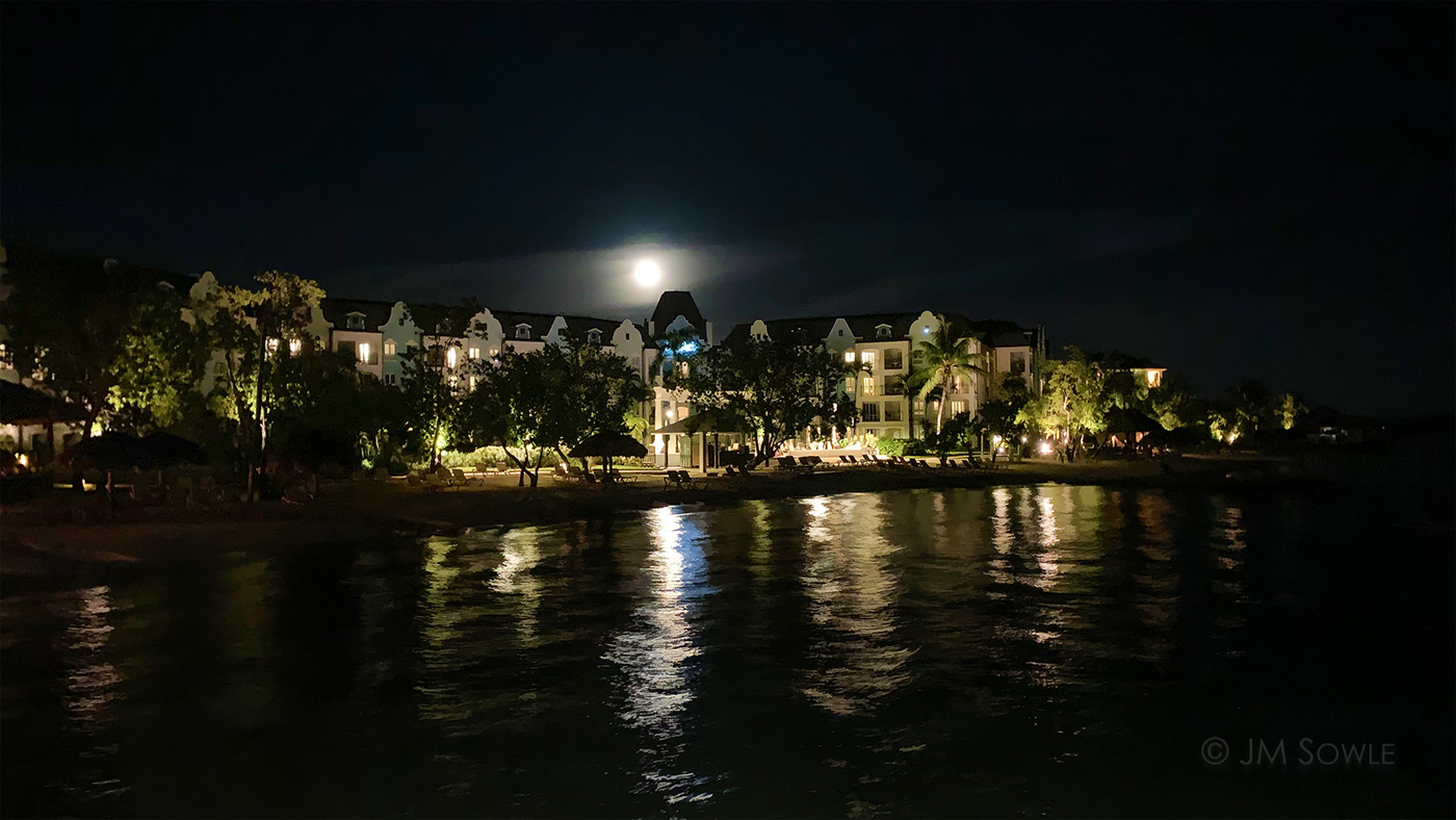 IMG_8958Adk_1400.jpg - A night time phone picture of the resort looking back from the over water bar.  We always take a walk around the grounds after dinner.