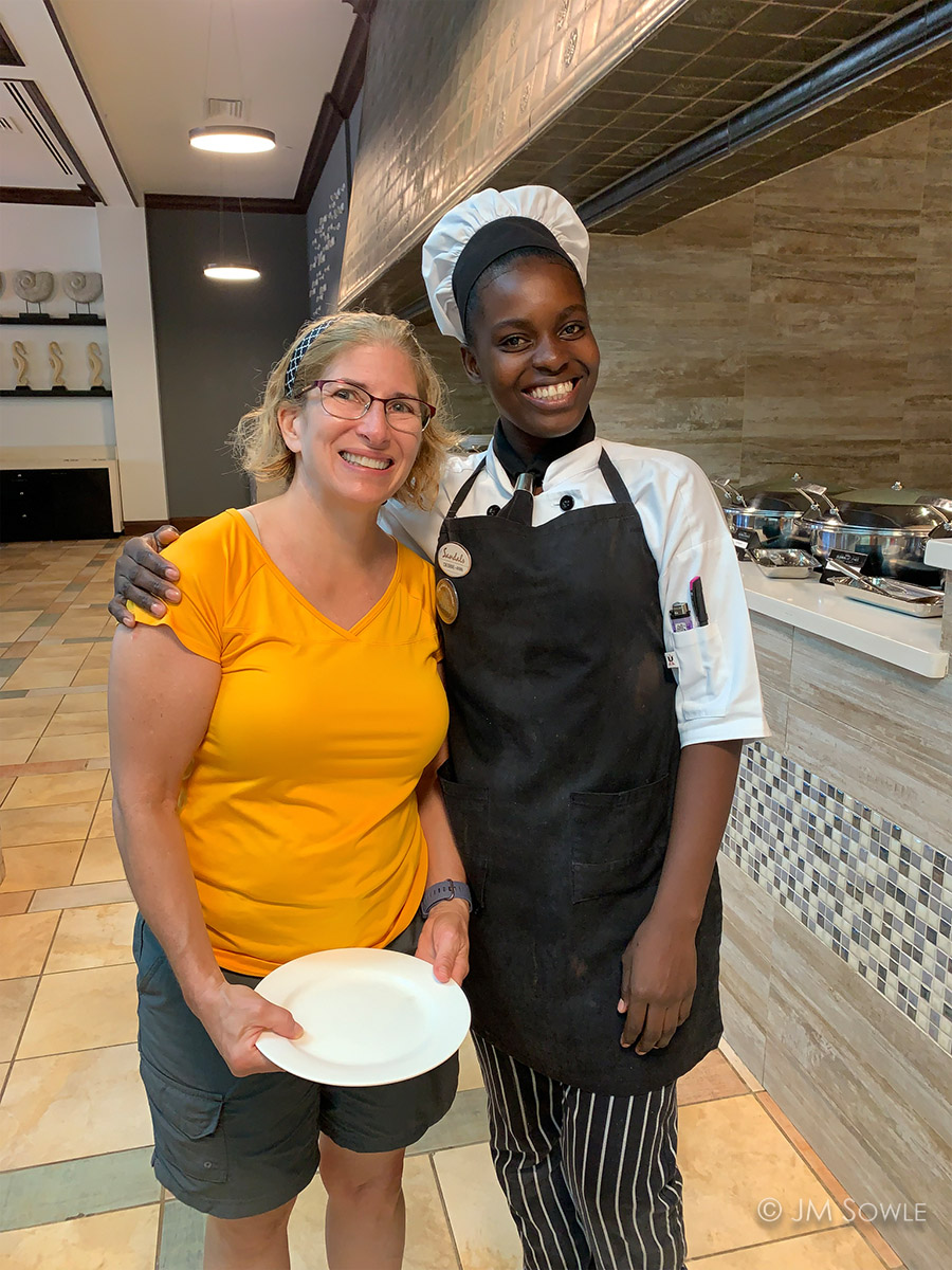 IMG_9010Adj_1200.jpg - A phone picture of our favorite omelet maker (Debbie-Ann).  She was always friendly and always smiling.  The staff is a big reason why we  keep returning to Sandals resorts.