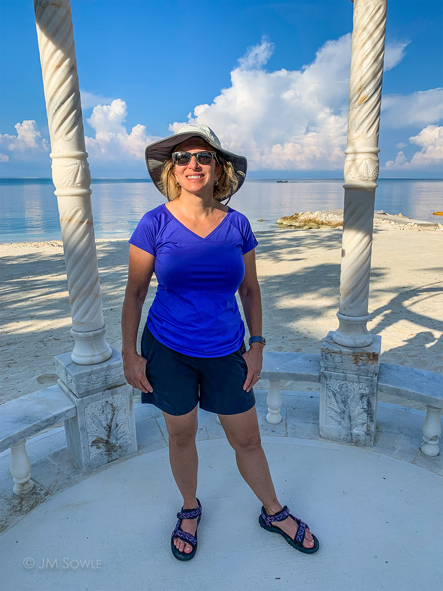 IMG_9059Adj_1200.jpg - A phone picture of Hali during our pre-breakfast walk along the beach area.  We walk a lot on these vacations!