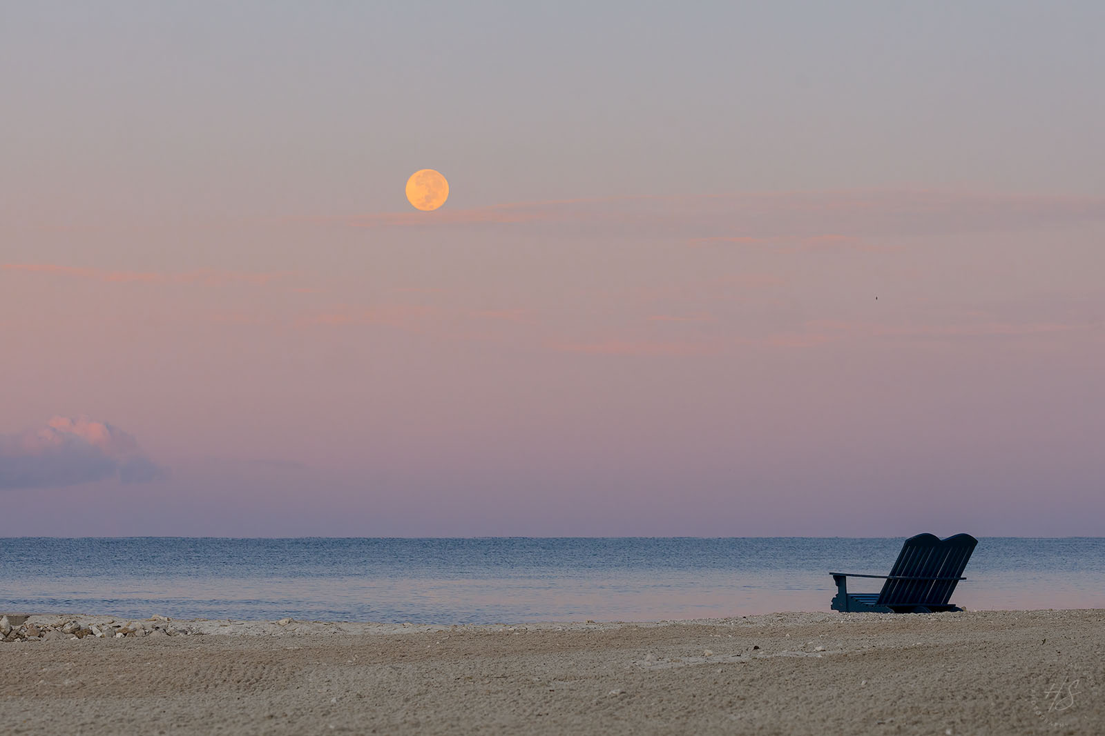 2021_09_SandalsSouthCoast-10317-Edit1600.jpg - Another photo of the full moon setting over the ocean as the sun begins to rise.  The moon dropped into a bank of clouds shortly after this.