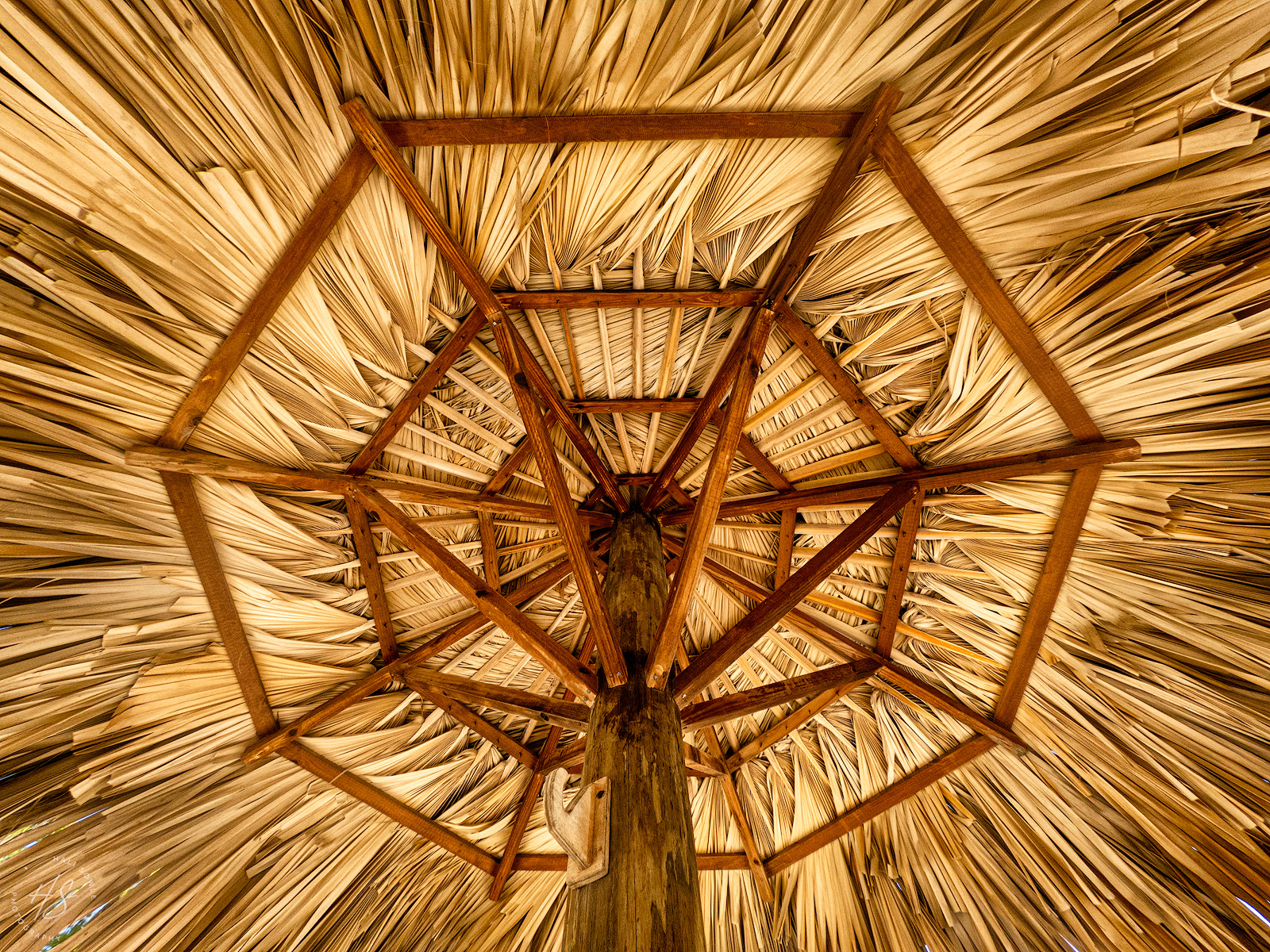2021_09_SandalsSouthCoast_GoPro-10331-Edit1600.jpg - Looking up at the intricate underside of a beach umbrella/palapa