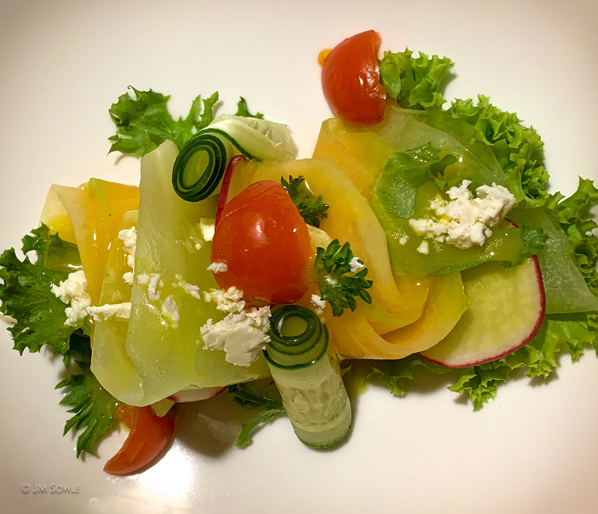 IMG_2250_1200.jpg - Just a phone pic of an appetizer we tried (sliced melon with feta cheese and a tangy citrus sauce).
