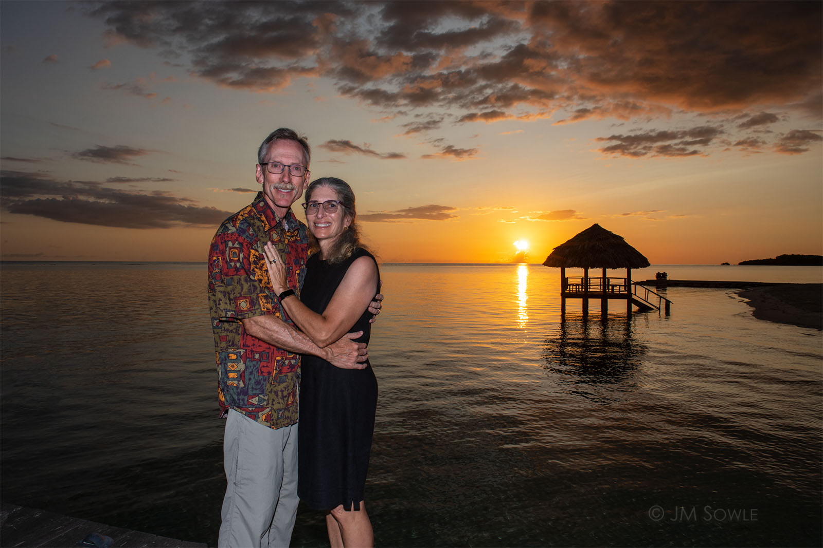 _JMS0330_1600.jpg - Oh look, they're hugging again with another beautiful sunset as a backdrop.  And look a palapa.  Again.