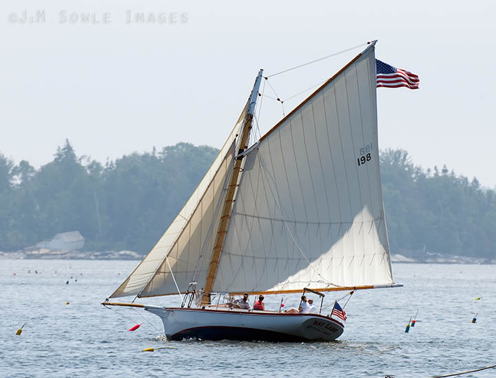_JMS0131.jpg - A beautiful friendship sloop cruising around Boothbay Harbor on a slightly foggy day.  If you look up the term "friendship sloop" on Wikipedia you will see an image of this very sailboat.