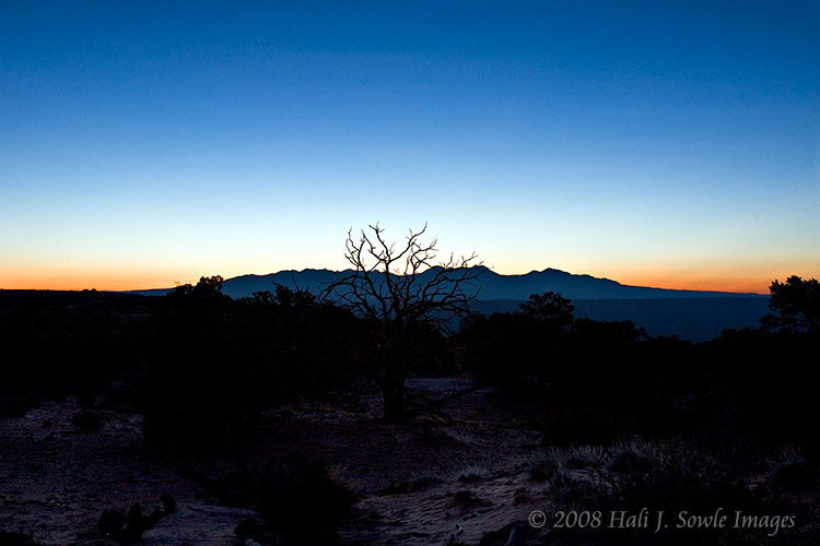 2008_09_02_Moab_001.jpg - Sunrise over La Sal Mountains.  From the rise just before Mesa Arch the sky just started to glow.  10 minutes earlier and I probably would have had stars.