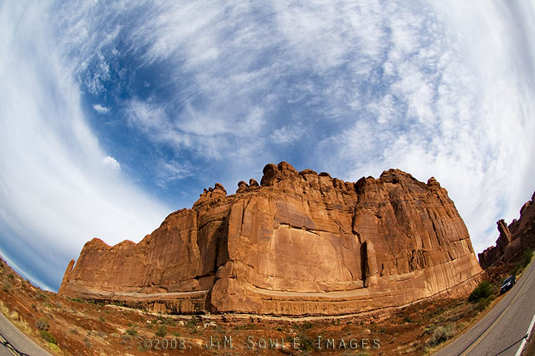 _DSC0295.jpg - I'm not sure of the name for this rock formation.  Courthouse?  The black Impala was our rental car for the week.