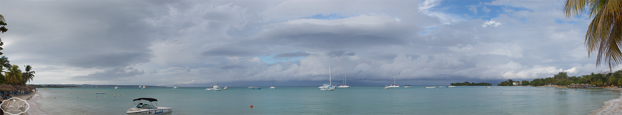 2014_01_SandalsNegril-11148-Edit1000.jpg - The view from the beach looking west the morning we left.  The storm clouds were just beginning to clear out.