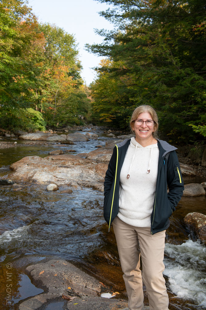 _MS00064.jpg - Hali posing for a picture near the stream that runs through Woodstock.  It was the morning after our big hike, and we were nicely rested at this point.
