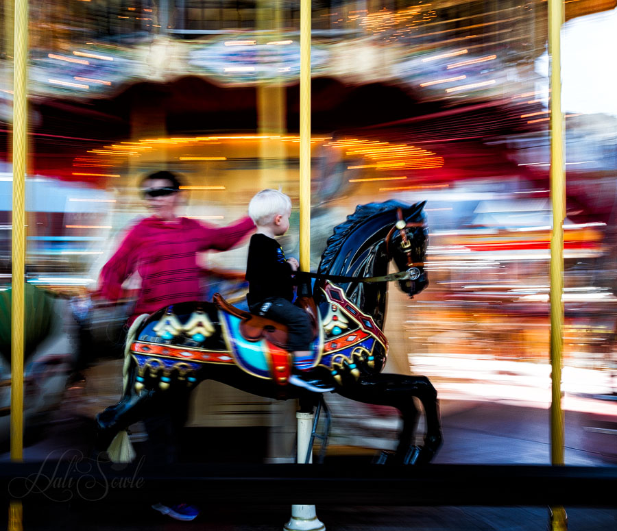 NorthCali2014_70.JPG - "And the seasons they go round and round And the painted ponies go up and down, We're captive on the carousel of time"   The Carousel on Pier 39, San Francisco.