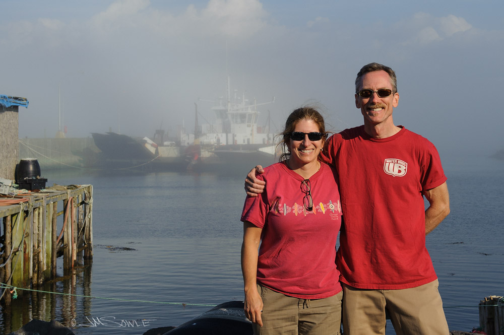 NovaScotia_40.JPG - Waiting for the ferry after our whale watch, we met a group of bikers from Canada.  We took a group a group photo for them, and they snapped this shot for us.  The fog was rolling in very quickly behind us.