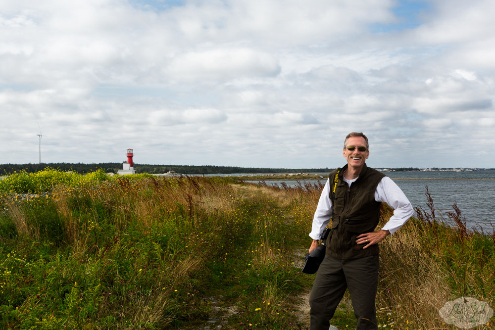 NovaScotia_46.JPG - Mike on the path to the East Pubnico Lighthouse.  Although we didn't see all of the lighthouses along the Acadian Shore we stopped at 4 of them and each was very different than the other.