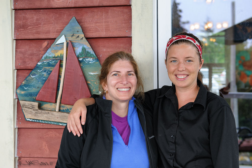 NovaScotia_68.JPG - The same shot, but this time with our excellent waitress (Emily).  This was our first meal there, and we had a super meal out on the deck.  The fog rolled in as we ate, but it didn't diminish the meal at all.  This is a far better choice for a meal than the place next to the lighthouse at Peggy's Cove!
