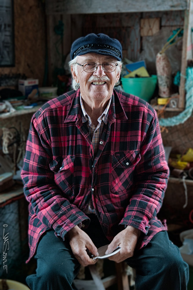 NovaScotia_70.JPG - The Buoy Shack proprietor, Roger H Crooks, is a very friendly fellow.  It was late in the day and he was getting ready to stop his current task (some finish work on a sea shell) and close shop.  However, he kept his shop open a little late for us.  He graciously allowed me to snap a few photos as well.  If you happen by Peggy's Cove you should be sure to stop by The Buoy Shack and say hello.
