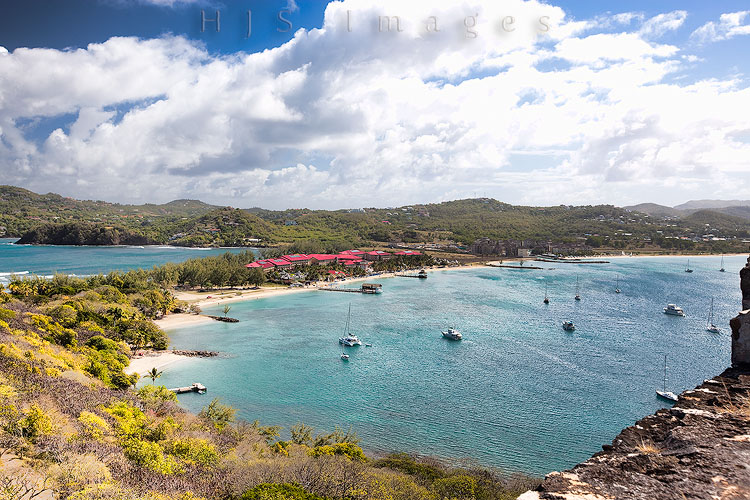 2010_01_18_SandalsGrandeStLucian-10121-Web.jpg - The resort and Rodney Bay as seen from the ruins of Ft. Rodney.  We had a great time sailing all around this beautiful bay with the Hobies from the resort.  You can see the wind lines on the water.  The breeze was constant at about  15 with gusts up to 20 knots.  One day we had fantastic sailing when the winds were blowing about 25 knots.  That was the only day they had a yellow flag up.  Kudo's to the resort for that -- we've been to other resorts where they fly a red flag for less.