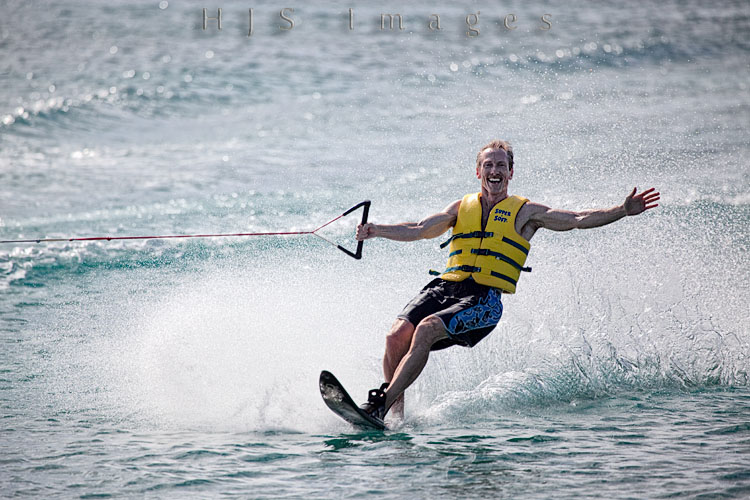2010_01_18_SandalsGrandeStLucian-10170-Web.jpg - Mike taking a pull behind the water skiing boat and loving every minute of it.  The guys at water sports were really great and they pulled him in close enough to where I was standing so that I could get a good picture.