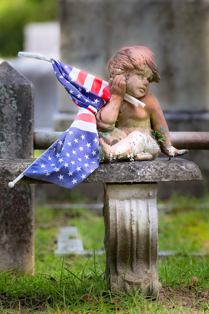 2016_06_Savannah_Charleston-10819-Edit1000.jpg - Cherub with American flags, Bonaventure Cemetery.  We spent hours wandering the cemetery, taking countless images of the beautiful statuary.