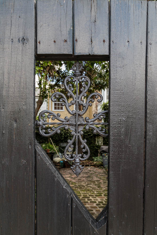 2016_06_Savannah_Charleston-11717-Edit1000.jpg - Another beautiful wrought iron decoration in a door leading to a garden.