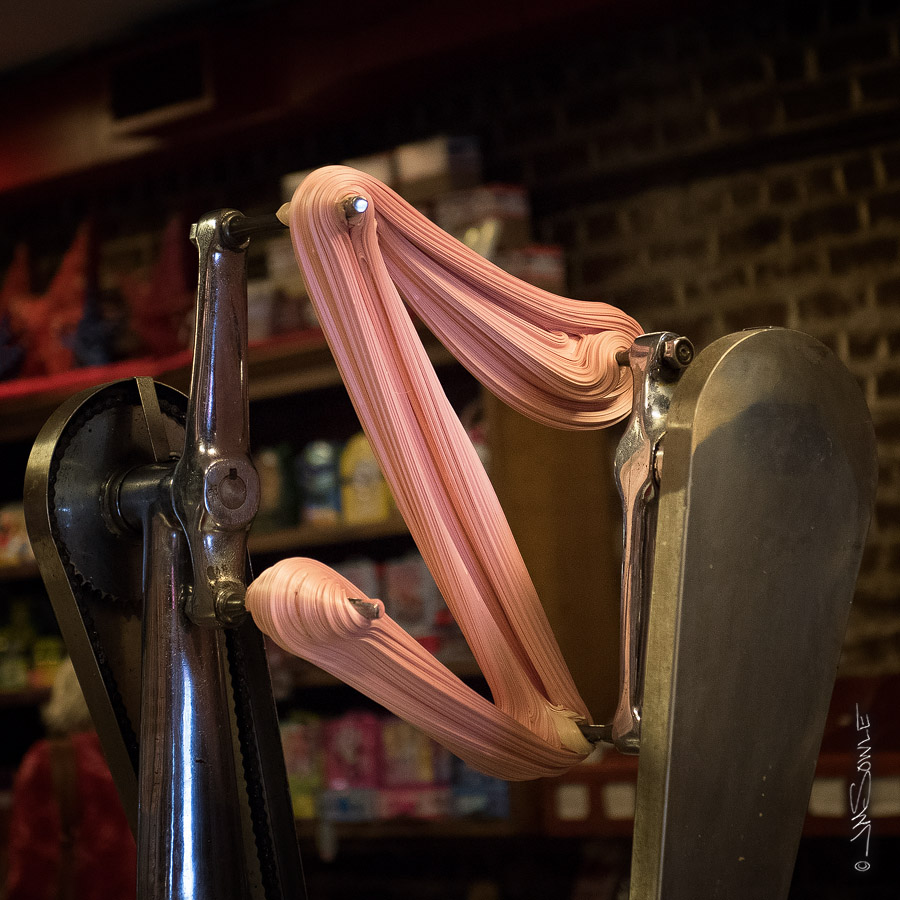 _JMS0012.jpg - An old fashioned taffy pulling machine in that same candy store.  It was an impressive candy store.  We were given a free sample from this batch, and it was delicious!