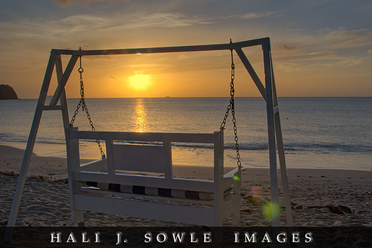 2008_05_11_Rendezevous_00032_3_4.jpg - Sunset from the beach, the first few days we were there there was a lot of haze and low clouds on the horizon.  The last two days saw spectacular sunsets.