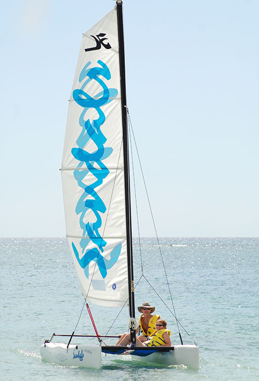 002_2ADJ.jpg - A resort photographer got this shot of us coming back from a sail...