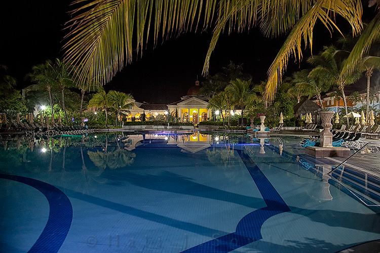 2011_11_SandalsWhitehouse-10137-Edit.jpg - The main pool off the piazza lit up at night.