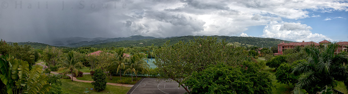 2011_11_SandalsWhitehouse-10932-6Pano.jpg - A rainstorm was moving in from the east over the mountains of Jamaica but to the west the sky was still bright blue.
