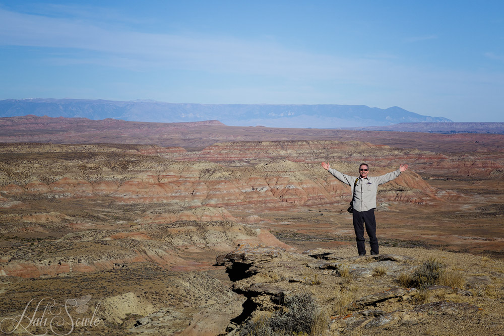 2015_09_20_Yellowstone-10292-Edit1000.jpg - Mike, feeling the expansiveness of the Wyoming sky and landscape, at McCullough Peaks Wild Horse Management Area