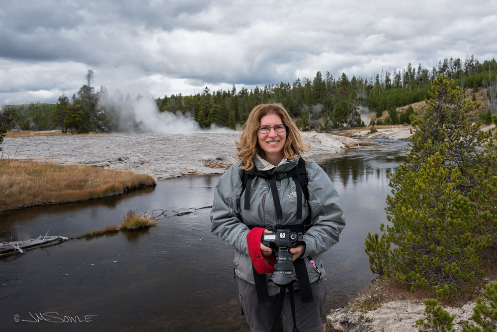 _JMS1115.jpg - I managed to get a shot of Hali with some steam rising from a geyser in the background.  The full boardwalk trail is several miles, so backpacks were a requirement!