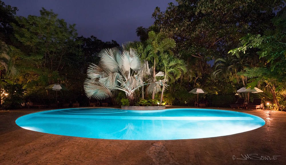 CostaRica2013_09.JPG - The Harmony Hotel pool at night.  The resort kept early hours, so the pool closed at 9pm and the whole place basically shut down at 10pm.  Great for us.  Bad for party animals.  During the day, the pool was a great place to chill and rest-up between surf sessions.