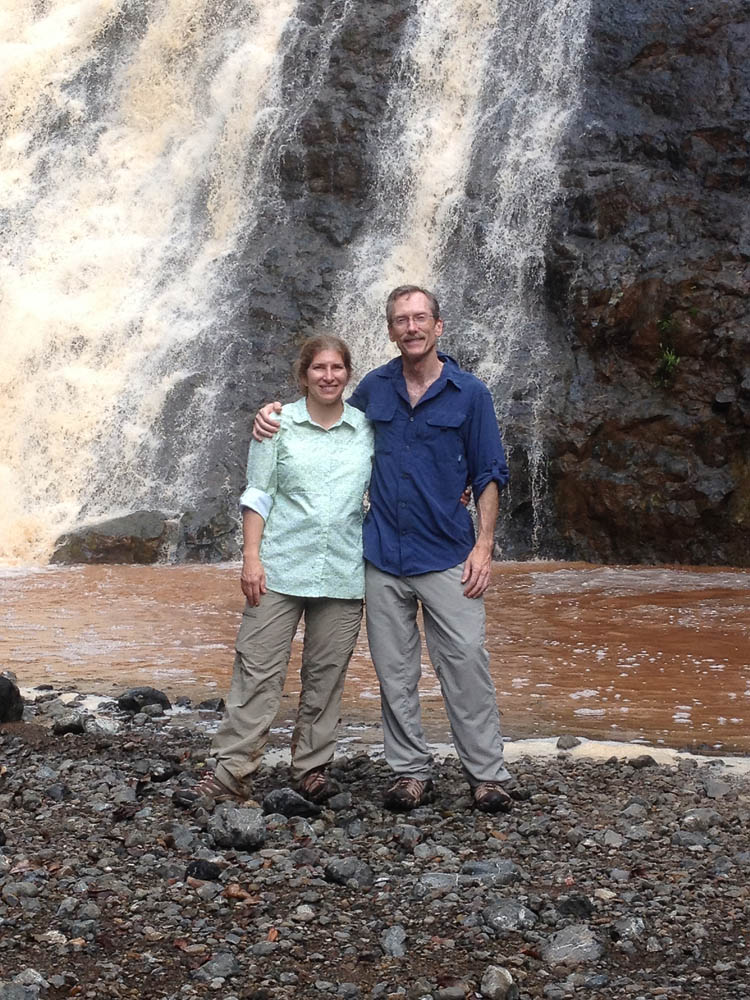 CostaRica2013_17.JPG - About 3/4 of the way through the zip lines, we paused at a waterfall.  Sadly, it was running brown due to recent rains.  Thanks to Rebecca Gregory for this picture!