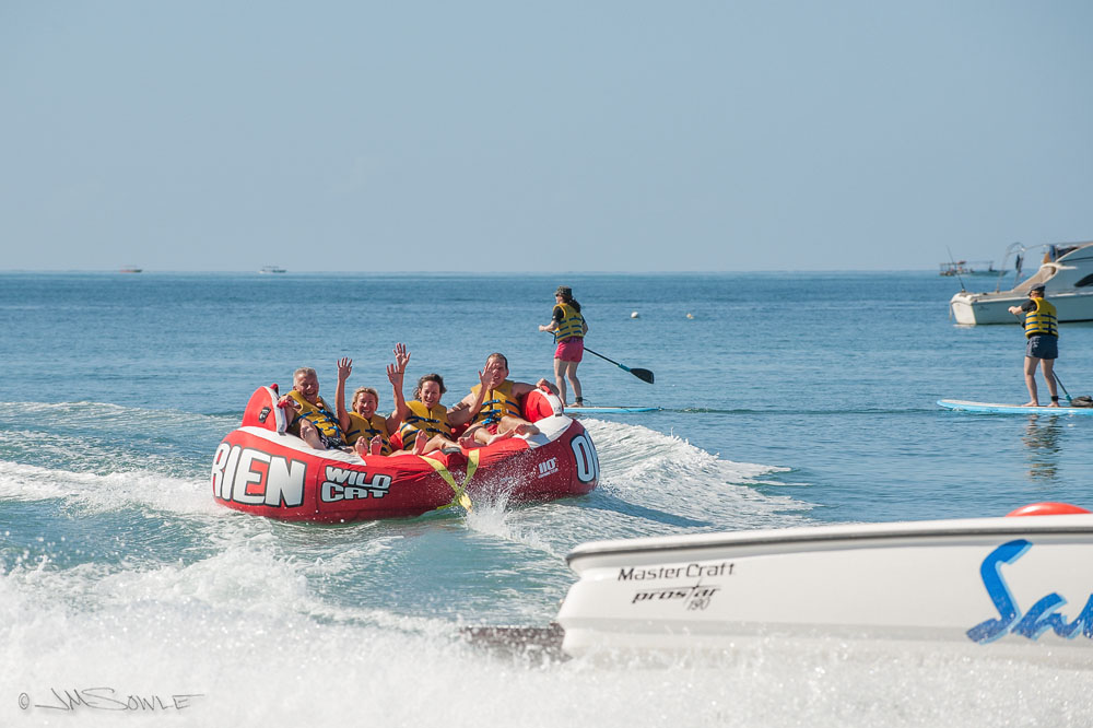 _JIM0121.jpg - This crazy tube-like tow-toy was a lot of fun.  The group shown here includes all of the regular water skiers that would show up every day.  Very nice people!